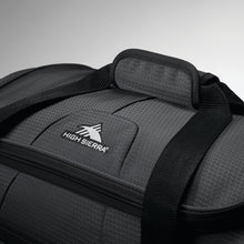 Load image into Gallery viewer, Angled close up to the top of the black wheeled duffel bag.