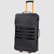 Load image into Gallery viewer, Angled front view of the suitcase with the telescopic handle extended.