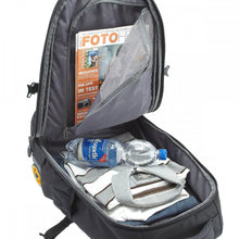 Load image into Gallery viewer, Interior view of the backpack's main compartment filled with magazines, clothes and a water bottle.