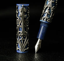 Load image into Gallery viewer, Close up to the fountain pen cap, nib, and grip section.