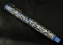 Load image into Gallery viewer, Side view of the fountain pen on a black textured surface.