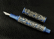 Load image into Gallery viewer, Front view of the fountain pen with the cap next to it.