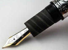 Load image into Gallery viewer, Close up to the fountain pen nib with engraved decorations, KRONE logo, 18K gold hallmark, and the letter M.
