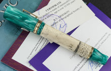 Load image into Gallery viewer, Side view of the fountain pen on top of the certificates.