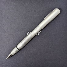 Load image into Gallery viewer, Side view of the silver rollerball pen with the cap posted.