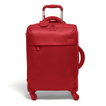 Load image into Gallery viewer, Front panel view of the cherry red suitcase with the telescopic handle extended.