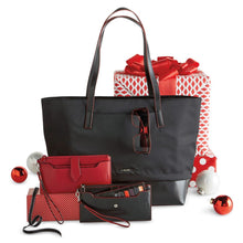 Load image into Gallery viewer, The tote bag arranged with a selection of wallets, wrapped gifts, and christmas decorations.