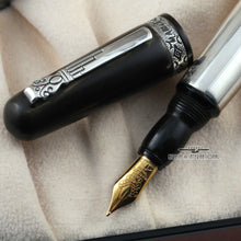Load image into Gallery viewer, Close up to the fountain pen nib, grip section, and the cap.