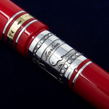 Load image into Gallery viewer, Close up to the Marlen logo and decorations engraved on the band by the grip section.