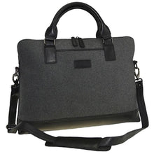 Load image into Gallery viewer, Angled front panel view of the briefcase with the shoulder strap attached.