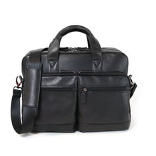 Load image into Gallery viewer, Front panel view of the black briefcase with the shoulder strap hanging from the top panel's side.