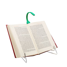 Load image into Gallery viewer, An open book on a stand with the green book light