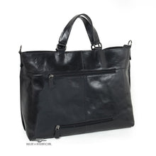 Load image into Gallery viewer, Back panel view of the black leather bag. It features two zipper-closing compartments.