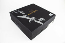 Load image into Gallery viewer, Angled view of the outer box. It has a dent on the front.