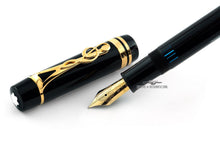 Load image into Gallery viewer, Close up to the fountain pen nib, cap, and grip section.