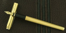 Load image into Gallery viewer, The fountain pen nib resting on the cap.