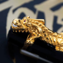 Load image into Gallery viewer, Close up to the golden dragon clip, holding a pearl in its mouth.