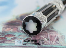 Load image into Gallery viewer, Close up to the top of the cap, featuring a Mother of Pearl Montblanc Logo.