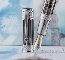 Load image into Gallery viewer, Close up to the cap, nib, and grip section of the pen.