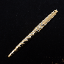 Load image into Gallery viewer, Front view of the fountain pen with the cap on, inside the presentation box.