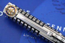 Load image into Gallery viewer, Close up to the clip on the pen, it features a diamond at the bottom, and the Rotary International badge at the top.