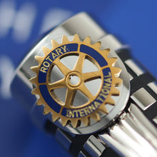 Load image into Gallery viewer, Close up to the Rotary International badge on the cap.