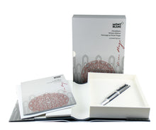 Load image into Gallery viewer, The pen arranged with the packaging and booklets on a white background.