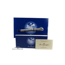 Load image into Gallery viewer, The fountain pen arranged with the included booklets and certificate on a white background.