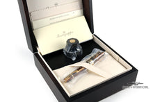 Load image into Gallery viewer, The fountain pen arranged inside the presentation box with the sealed ink bottle, booklets, and polishing cloth.