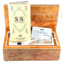 Load image into Gallery viewer, The fountain pen arranged in the presentation box with the certificate and booklet.