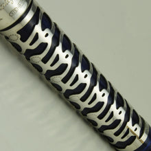 Load image into Gallery viewer, Close up to the silver skeleton overlay on the pen body.
