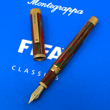 Load image into Gallery viewer, The fountain pen arranged on the lid of the presentation box.