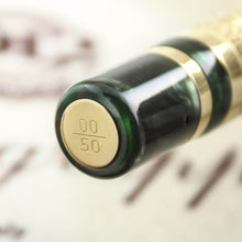 Load image into Gallery viewer, Close up to the engraved edition number at the pen's bottom, 0 of 50