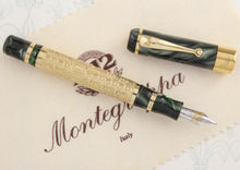 Load image into Gallery viewer, Front view of the fountain pen with the cap next to it.