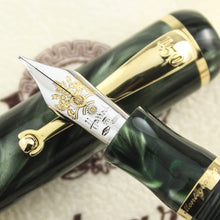 Load image into Gallery viewer, Close up of the fountain pen nib resting on the cap.