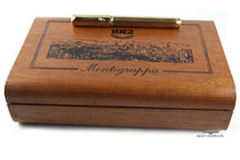 Load image into Gallery viewer, The fountain pen on top of the wooden presentation box.