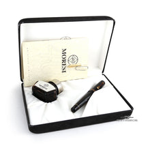 Load image into Gallery viewer, The fountain pen arranged in the presentation box with the ink bottle, extra nib, and booklet.