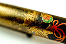 Load image into Gallery viewer, Close up to the decorations on the pen barrel.
