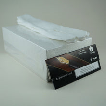 Load image into Gallery viewer, The sealed packaging box arranged with the care guide, registration card, and a pair of white cotton gloves.