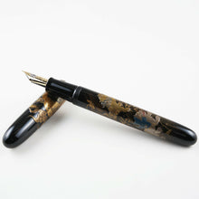 Load image into Gallery viewer, The fountain pen arranged with the cap on a white background.