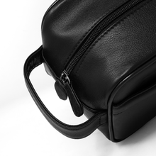 Load image into Gallery viewer, Angled close up to the shave kit showing the zipper tag and the grab handle.