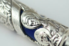 Load image into Gallery viewer, Close up to two monks engraved on the silver overlay.