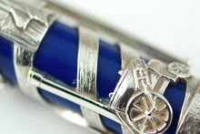 Load image into Gallery viewer, Close up to a steam machine engraved on the silver overlay.