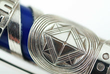 Load image into Gallery viewer, Close up to the decorations on the silver overlay.