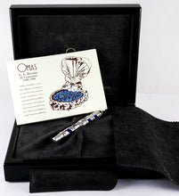 Load image into Gallery viewer, The fountain pen arranged with the presentation box, pamphlet, and pen sleeve.