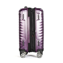 Load image into Gallery viewer, Side panel view of the purple suitcase. It features four stub legs. The expandable feature is unzipped.
