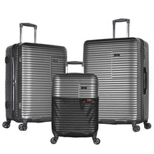 Load image into Gallery viewer, The Charcoal Gray carry-on, medium, and large suitcases arranged on a white background.