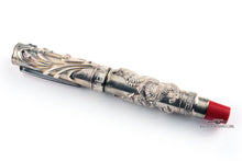 Load image into Gallery viewer, Side view of the silver fountain pen with the cap on.