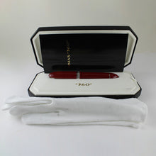 Load image into Gallery viewer, The red fountain pen arranged in the presentation box with a booklet and a pair of white cotton gloves.