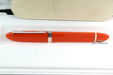 Load image into Gallery viewer, Side view of the orange pen in the presentation box.
